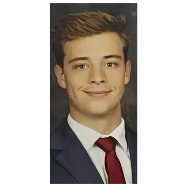 Portrait of Scott Corbin in a navy suit and red tie